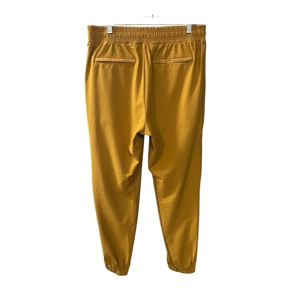 ATHLETA Brooklyn Joggers Women’s  NWOT Size 10 Gold